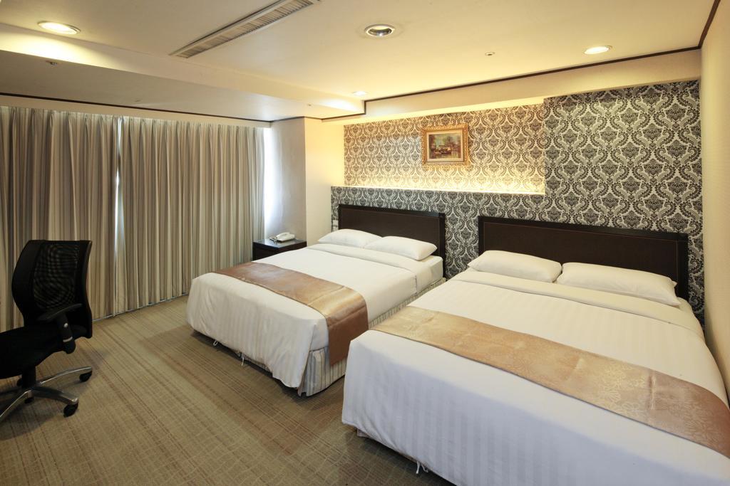 Lincoln Hotel Тайнань Номер фото